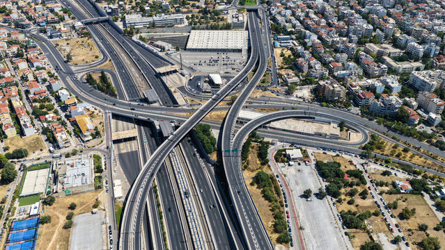 Aerial drone photo of urban multilevel highway junction road using multiple bridges forming a spaggheti road with light traffic