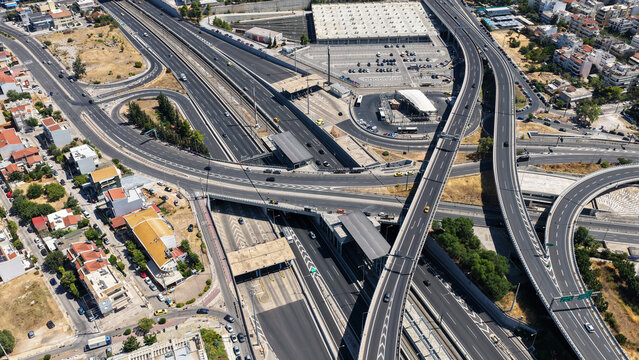 Aerial drone photo of urban multilevel highway junction road using multiple bridges forming a spaggheti road with light traffic