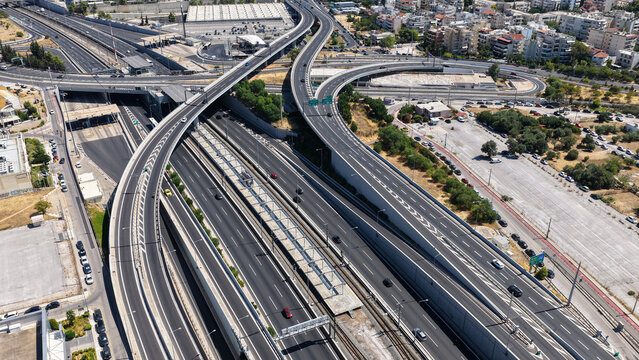 Aerial drone photo of popular multilevel highway junction overpass of Attiki Odos road, passing through Doukisis Plakentias Avenue with light traffic, Athens, Attica, Greece