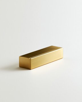 A solid brushed brass rectangular block with a smooth finish, isolated on a white background, for use as, a desk accessory, or paperweight