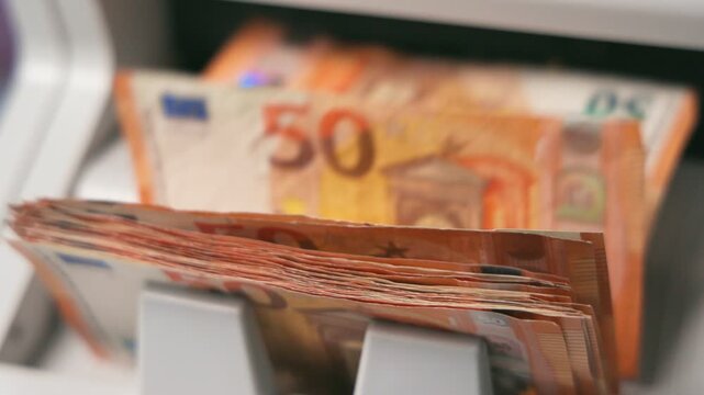 Automated Money Counting Machine Processing Stack of 50 Euro Banknotes