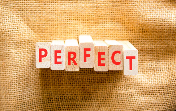 Perfect word symbol. Concept word Perfect on beautiful wooden blocks. Beautiful canvas background. Business perfect word concept. Copy space.