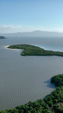 Florian&oacute;polis, Daniela Beach. Aerial View of Tropical Coastline. Establishing Shot. Santa Catarina, Brazil. Vertical video