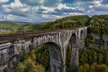 Fototapeta premium Old stone railroad bridge spanning a deep gorge in the Allegheny valley.