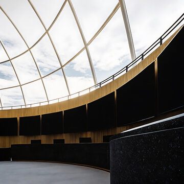 Curved architectural interior with wooden paneling and a grid patterned ceiling daytime scene architecture wall
