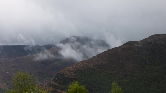 Dramatic mountain scenery with approaching stormfront in the Scottish highlands near Glencoe