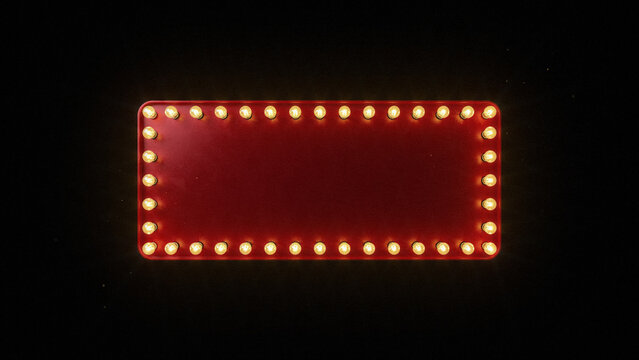 A rectangular red marquee sign frame with glowing warm yellow light bulbs around the edges isolated against a solid dark black background surface