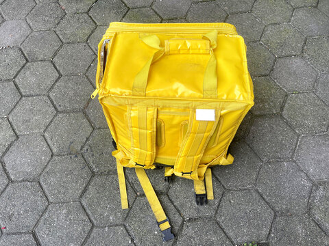 delivery bag isolated on the sidewalk. top view