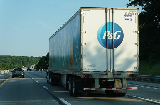Pennsylvania, U.S.A - Jul 10, 2026 - A large commercial semi-trailer featuring a bold P&G logo traveling along a highway in daytime traffic.