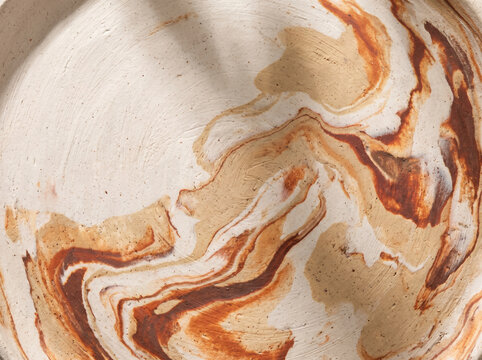 Clay surface blending cream rust with natural texture and abstract in warm tones