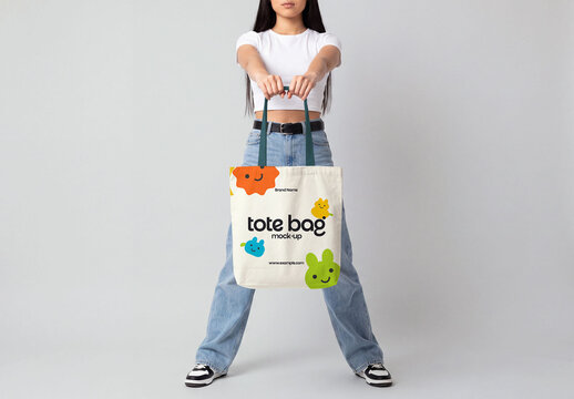 Young Woman Holding Canvas Tote Bag Mockup