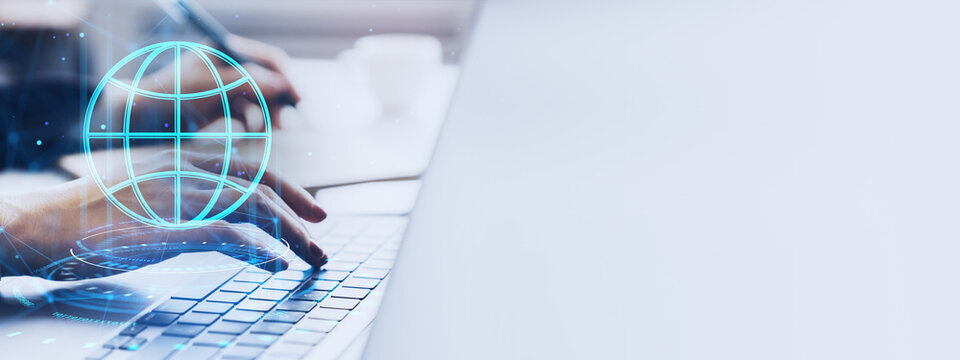 Worldwide technology business concept with professional hands typing on laptop and glowing global network interface, clean light banner background.