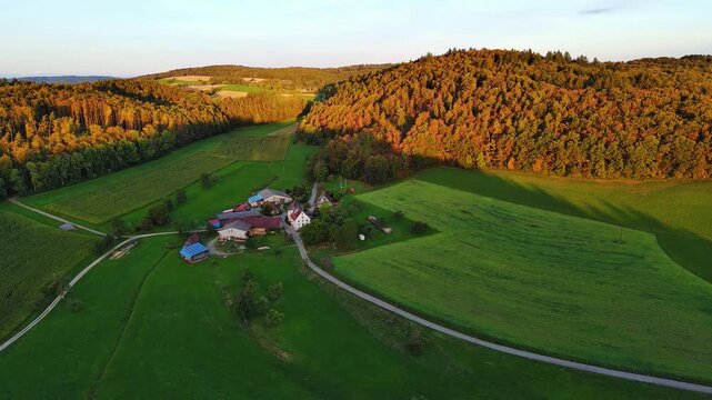 Aerial Drone View of Rural Village and Autumn Forests at Sunset