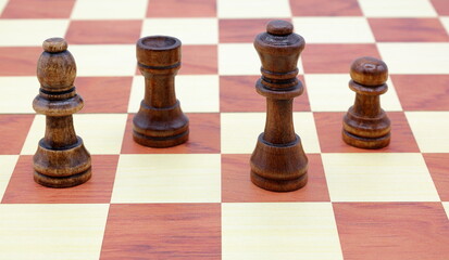 Wooden chess game. Concept pieces. Bishop, rook, queen and pawn. © Martin of Sweden