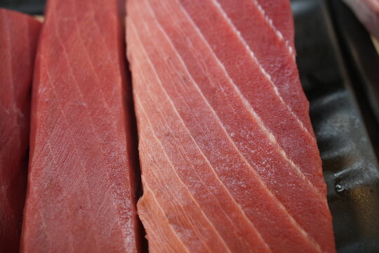 A close up shot of fresh raw tuna blocks.