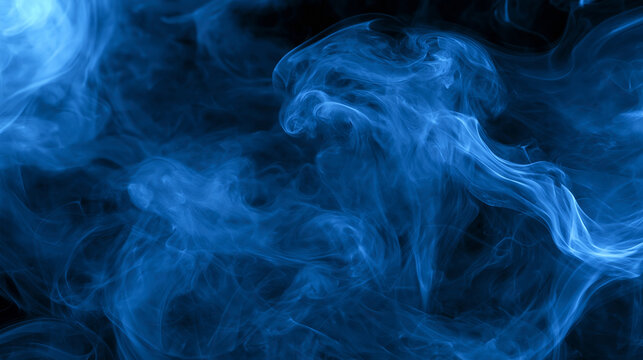 Dynamic blue smoke swirls floating gracefully against a dark black background. Excellent for mystical background designs and energy concepts.