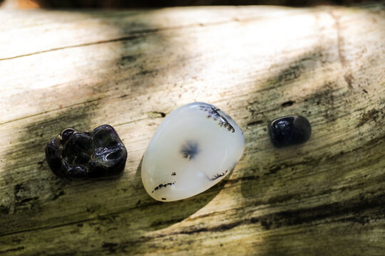 Healing crystals arranged on a rustic wooden surface