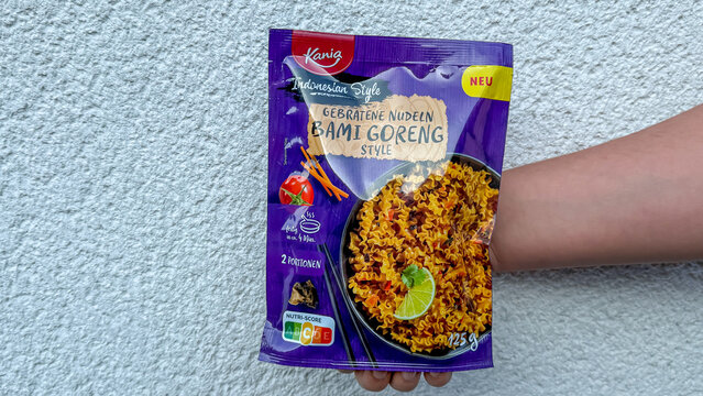 Hand holding kania indonesian style bami goreng noodles packaging