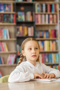 Schoolgirl struggling with math problem during classroom lesson