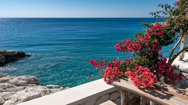 Beautiful sea view from a terrace with pink bougainvillea flowers plant