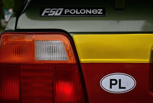 Close-Up of FSO Polonez Rear Tail Light and PL Sticker on Vintage Green Car.
