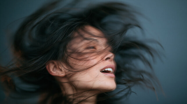 Carefree Woman with Windblown Hair in Motion