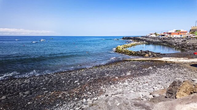 El Remo rocky beach coast kayaker arriving at shore time lapse La Palma Canary Islands Spain
