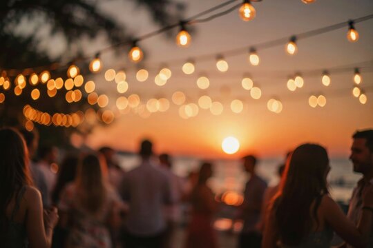People enjoying a beach party at sunset