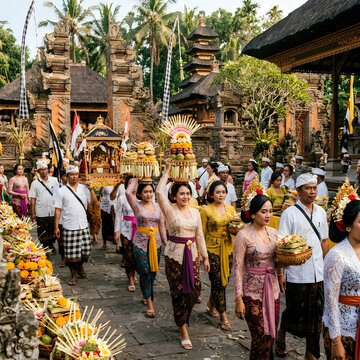 Traditional Balinese procession with women carrying offerings in vibrant festival attire