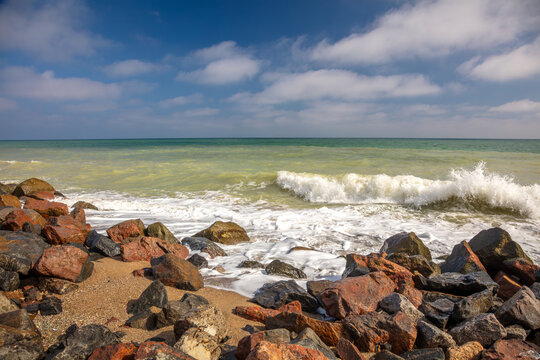 Wave Runs onto the Coastal Rocks