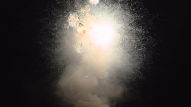 Firework explosions in night sky celebrating holiday 4k
