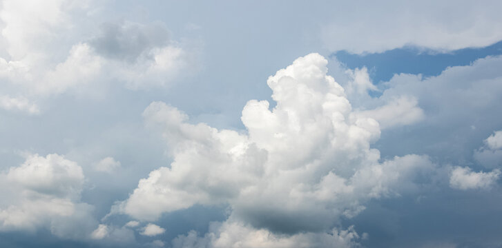 Panoramic sky with massive cumulus clouds before bad weather