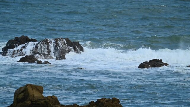 wave and rock at slow motion