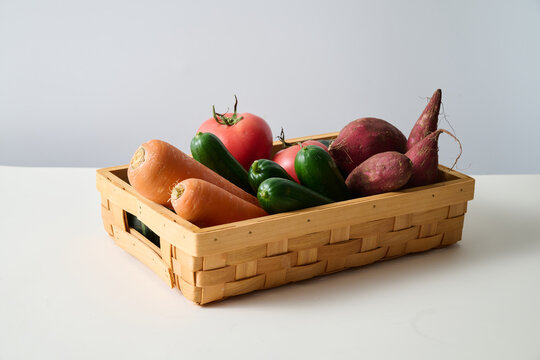Vegetables in Basket on White Background