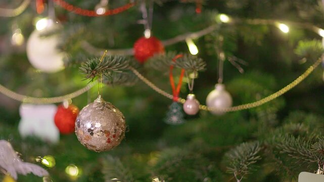 Close Up View of Christmas Tree Decorated with Ornaments and Lights