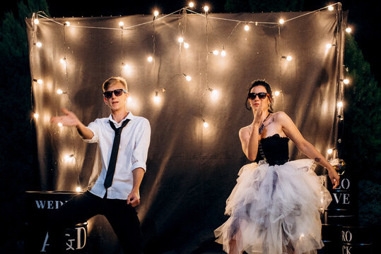 A dance of a young, unusual, freaky newlywed couple against
