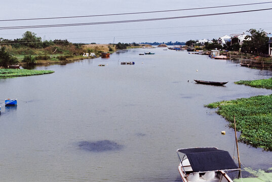 35mm analog photograph of boats on the Thu Bon River near Hoi An