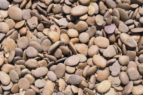 Natural Brown River Pebble Stones Texture Background Ideal for Landscaping Garden Decorative Ground Cover and Spa Design