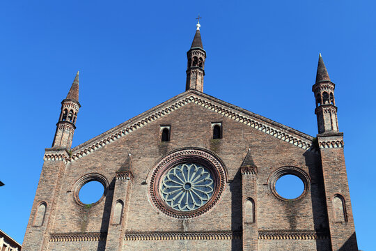 The terracotta facade of the Basilica of St. Francis of Assisi in Piacenza, a Lombard Gothic-style building