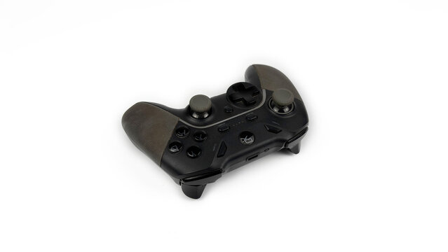 Kediri, East Java, Indonesia &ndash; August 23, 2026: Black Video Game Controller with Textured Grips Displayed on White Background