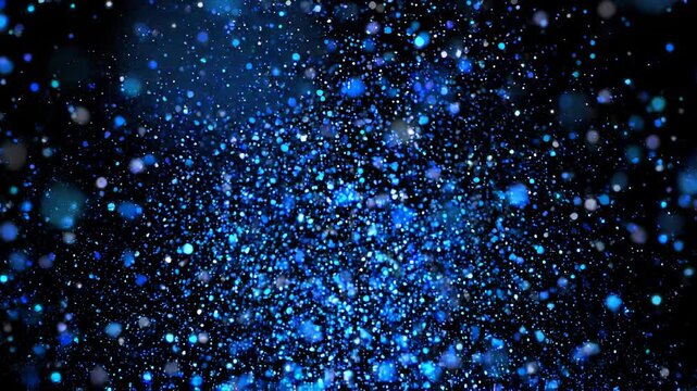 A dynamic blue glitter explosion expands on a black background, creating a vibrant abstract particle burst effect.