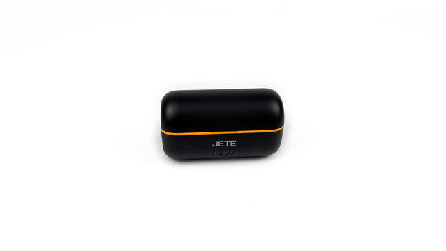 Kediri, East Java, Indonesia &ndash; August 21, 2026: Black and Orange Wireless Microphone Case with Components Displayed on White Background
