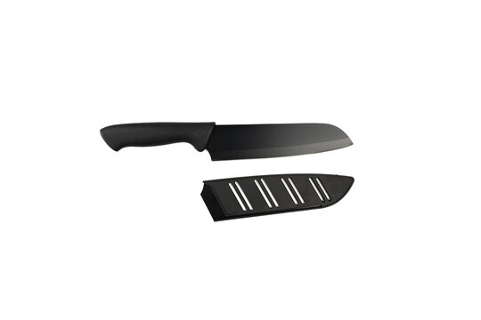 A black-bladed kitchen knife lies beside its matching black blade sheath, photographed from above on a plain white background.