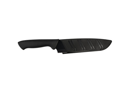 A black-bladed kitchen knife rests inside its matching black protective sheath, angled diagonally on a plain white background.