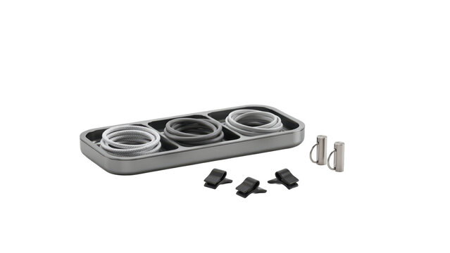 Three coiled cables in a rectangular gray tray with metal connectors and small black plastic cable clips isolated on a transparent background
