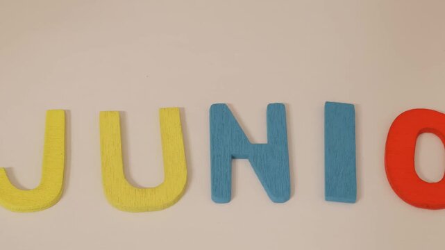 colorful wooden letters spelling out the word "junio"