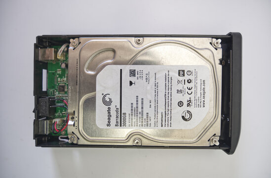 Suzano, Sao Paulo - Brazil - february 16, 2026: Connecting and assembling a hard drive enclosure