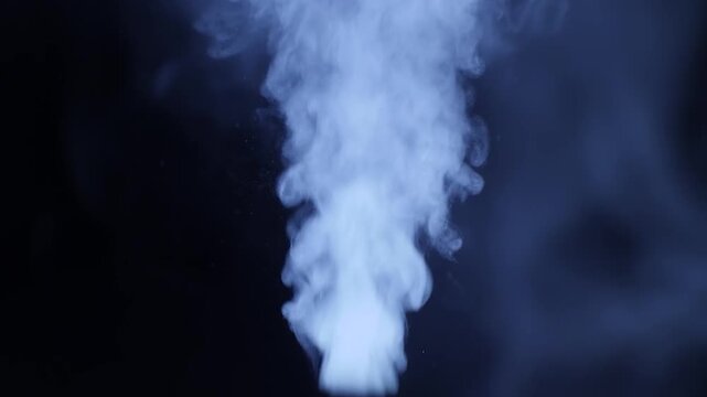 Abstract white smoke or steam rising against a dark black background, creating a soft, ethereal, and flowing atmospheric effect for creative design projects