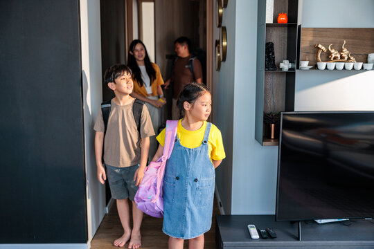 Family of four entering their vacation apartment