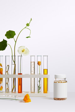 Test tubes and vitamin bottle on a simple surface